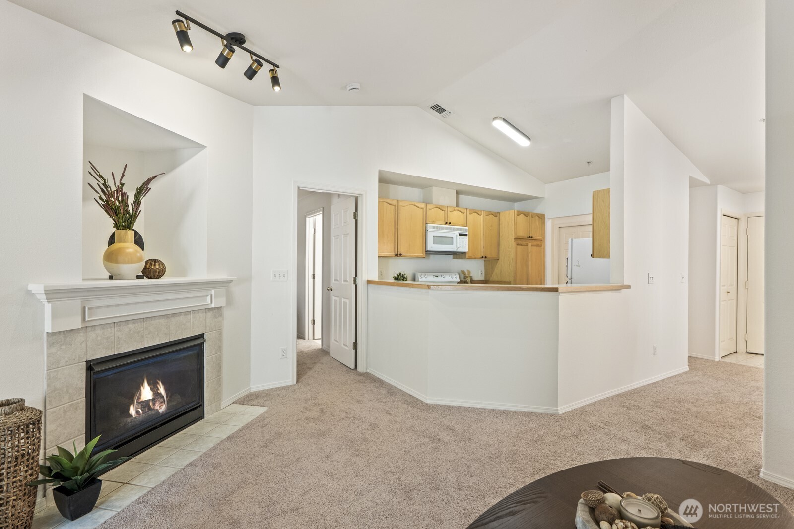 17204 123rd Place Northeast, Unit N304 Bothell, WA 98011 - Photo 18 of 40 a view of a livingroom with a fireplace and window