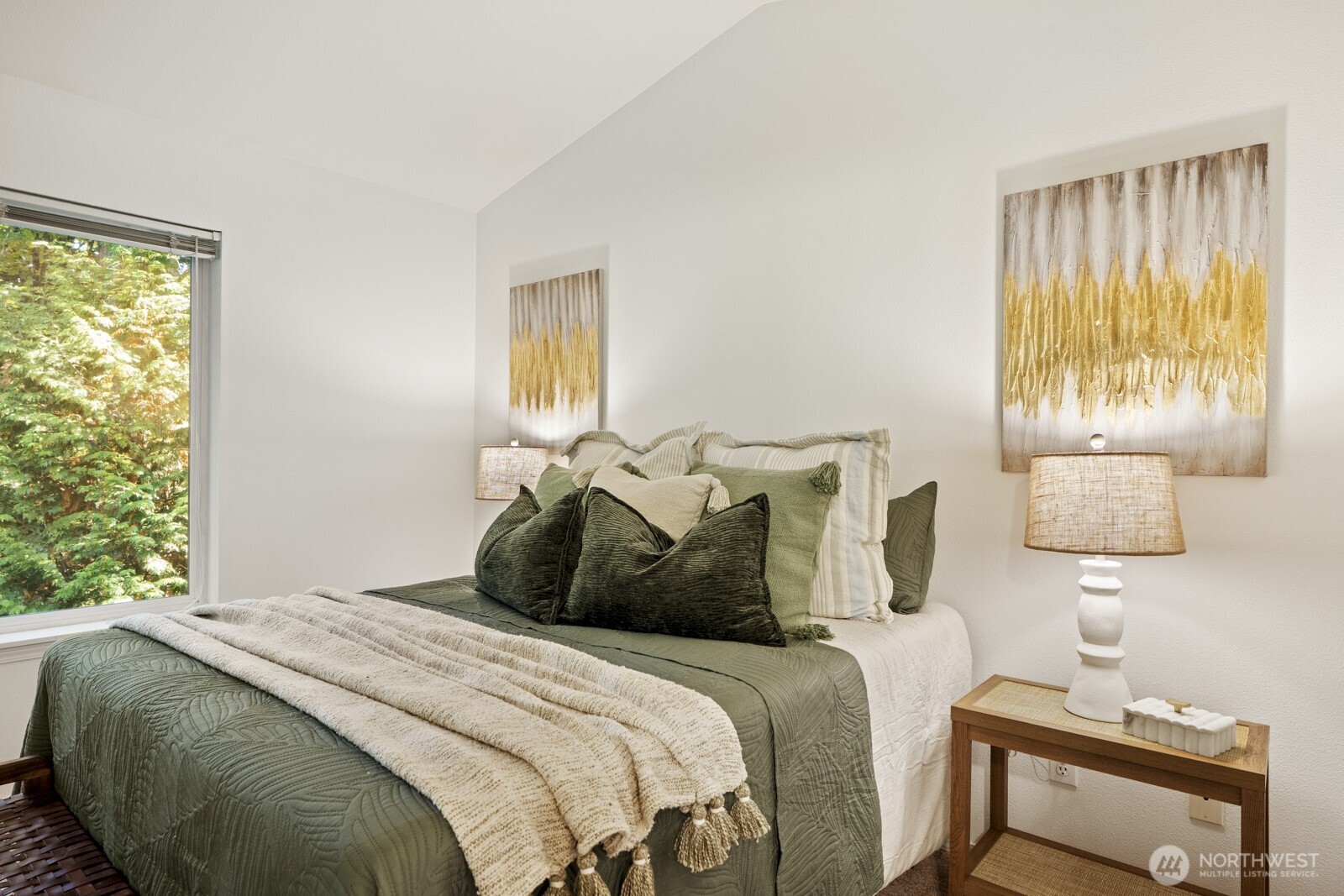 17204 123rd Place Northeast, Unit N304 Bothell, WA 98011 - Photo 23 of 40 a bedroom with a bed and a night stand