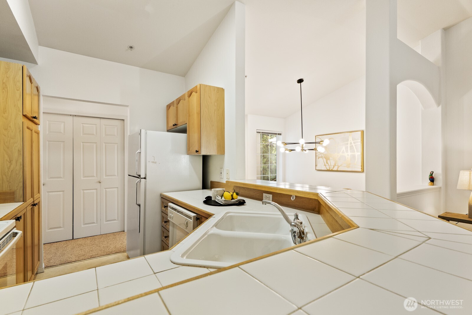 17204 123rd Place Northeast, Unit N304 Bothell, WA 98011 - Photo 30 of 40 a bathroom with a tub sink and mirror