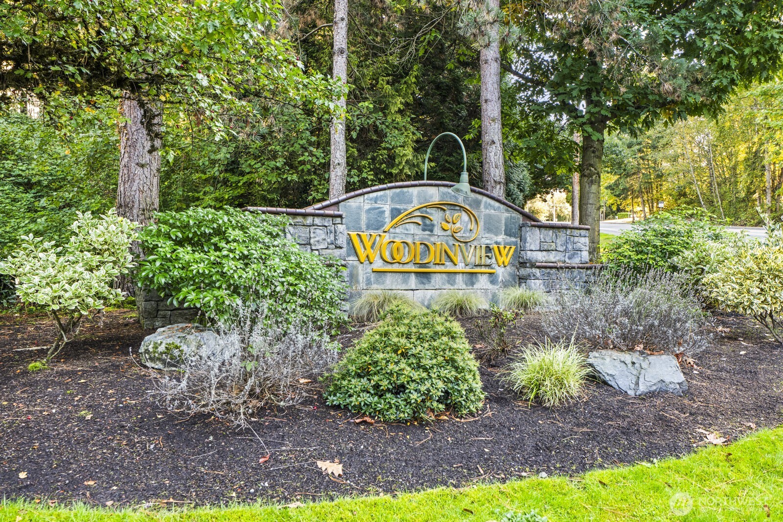 17204 123rd Place Northeast, Unit N304 Bothell, WA 98011 - Photo 3 of 40 a sign that is sitting in the middle of a park