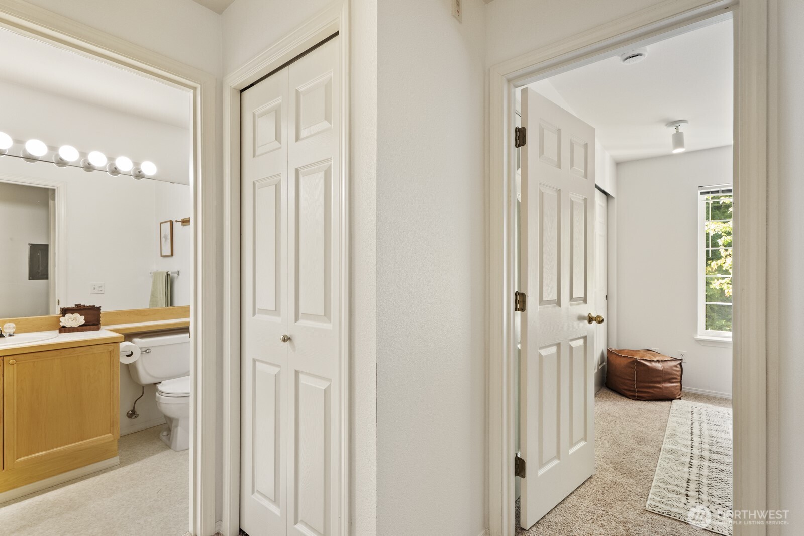 17204 123rd Place Northeast, Unit N304 Bothell, WA 98011 - Photo 31 of 40 a view of a bedroom with a bed and glass door