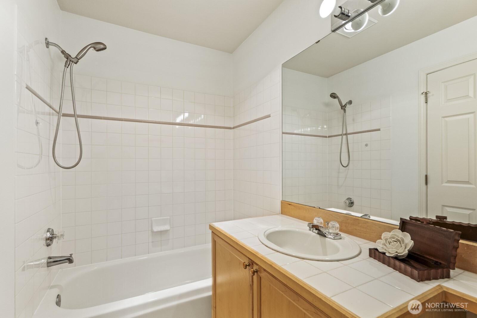 17204 123rd Place Northeast, Unit N304 Bothell, WA 98011 - Photo 33 of 40 a bathroom with a sink vanity granite tub and shower