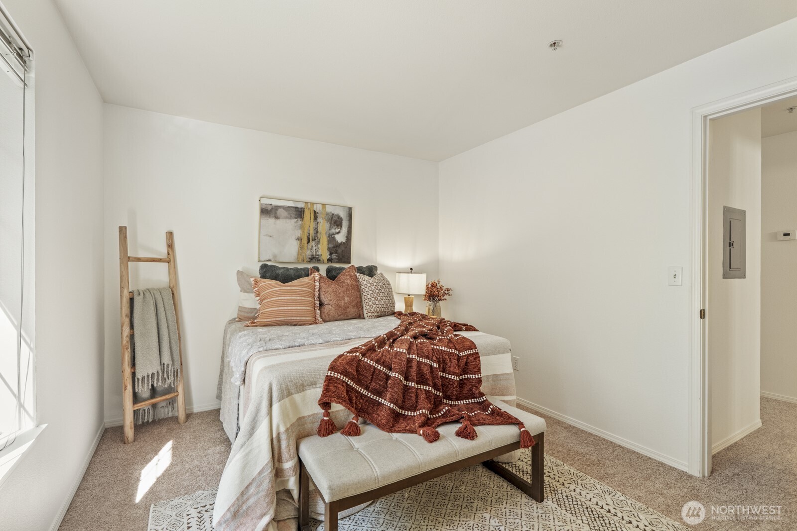 17204 123rd Place Northeast, Unit N304 Bothell, WA 98011 - Photo 35 of 40 a bedroom with a bed and wooden floor