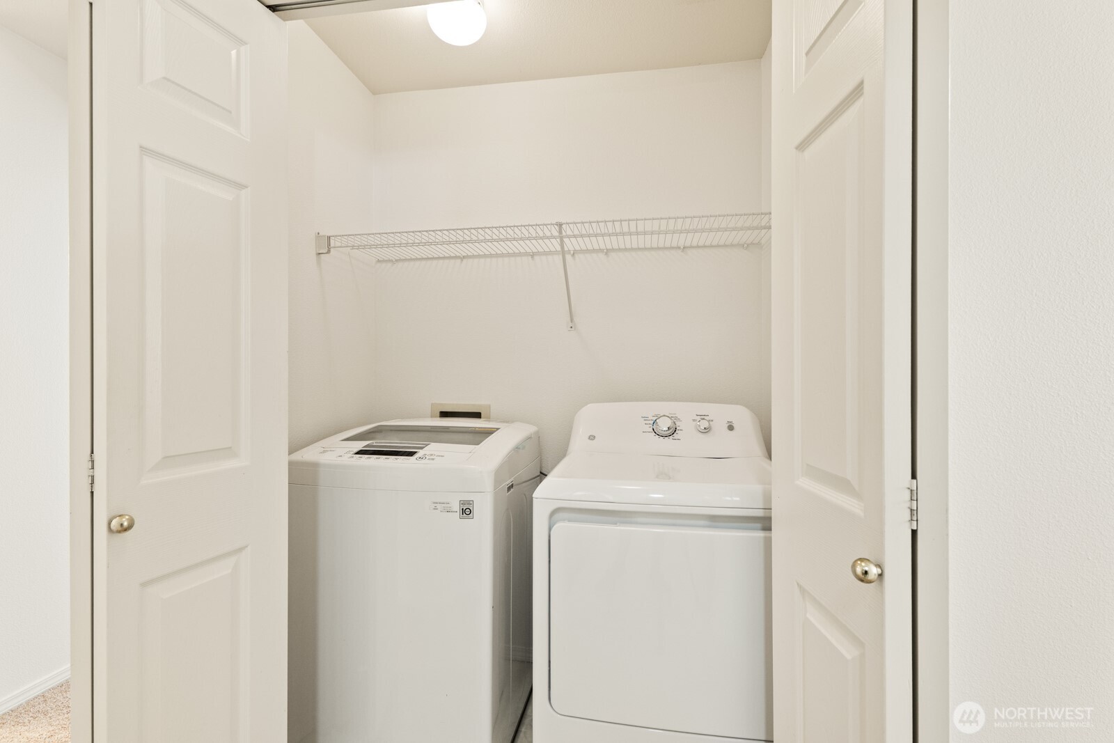 17204 123rd Place Northeast, Unit N304 Bothell, WA 98011 - Photo 36 of 40 a view of storage and utility room with dryer and washer