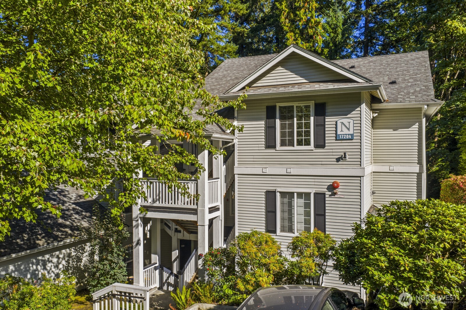 17204 123rd Place Northeast, Unit N304 Bothell, WA 98011 - Photo 4 of 40 a front view of a house with a garden