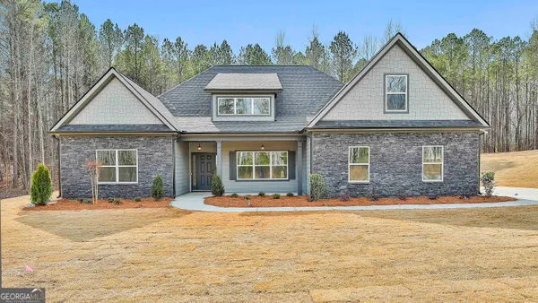 a front view of a house with a yard