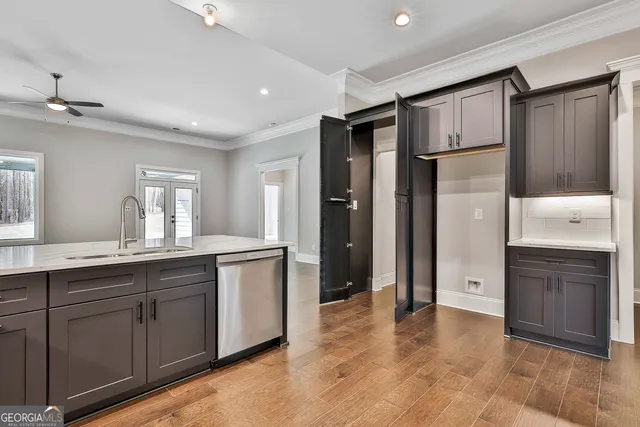 a spacious bathroom with a shower a sink and a mirror