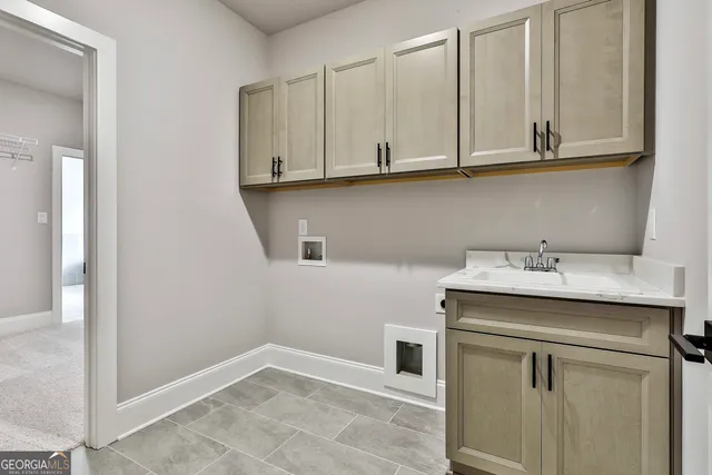 a utility room with cabinets