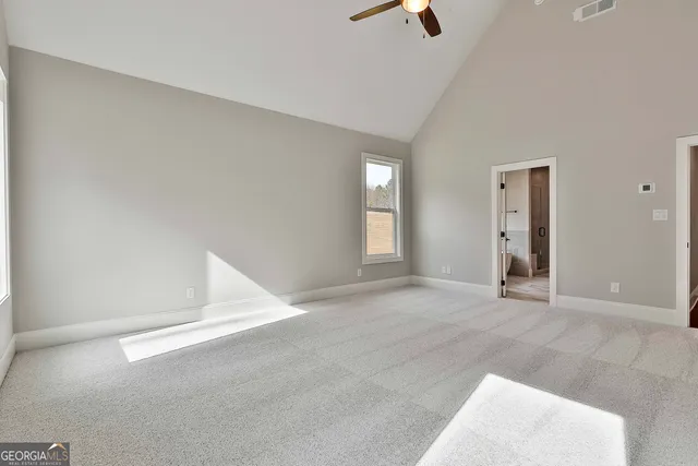 a spacious bathroom with a double vanity sink mirror and shower