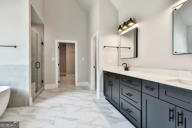 a bathroom with a bathtub and shower