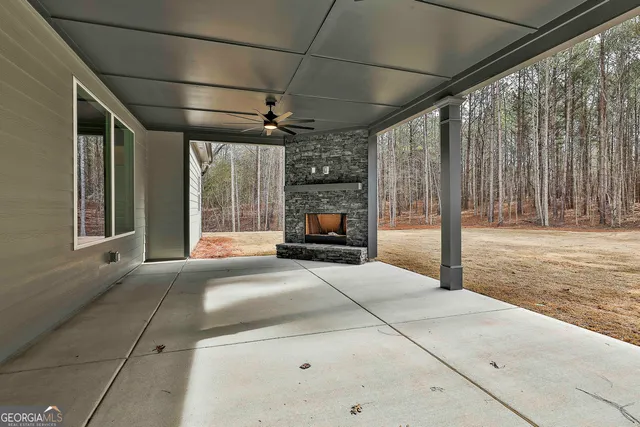 a view of empty room with wooden fence