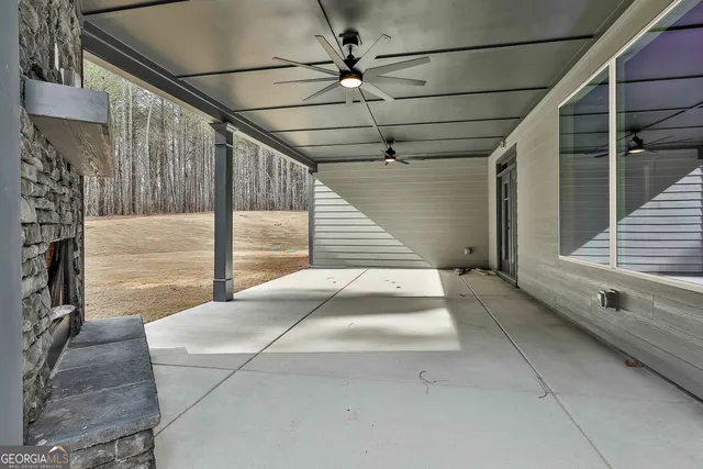 a large house with a big yard and large trees
