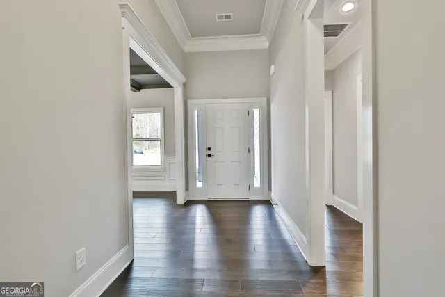 a view of entryway with wooden floor