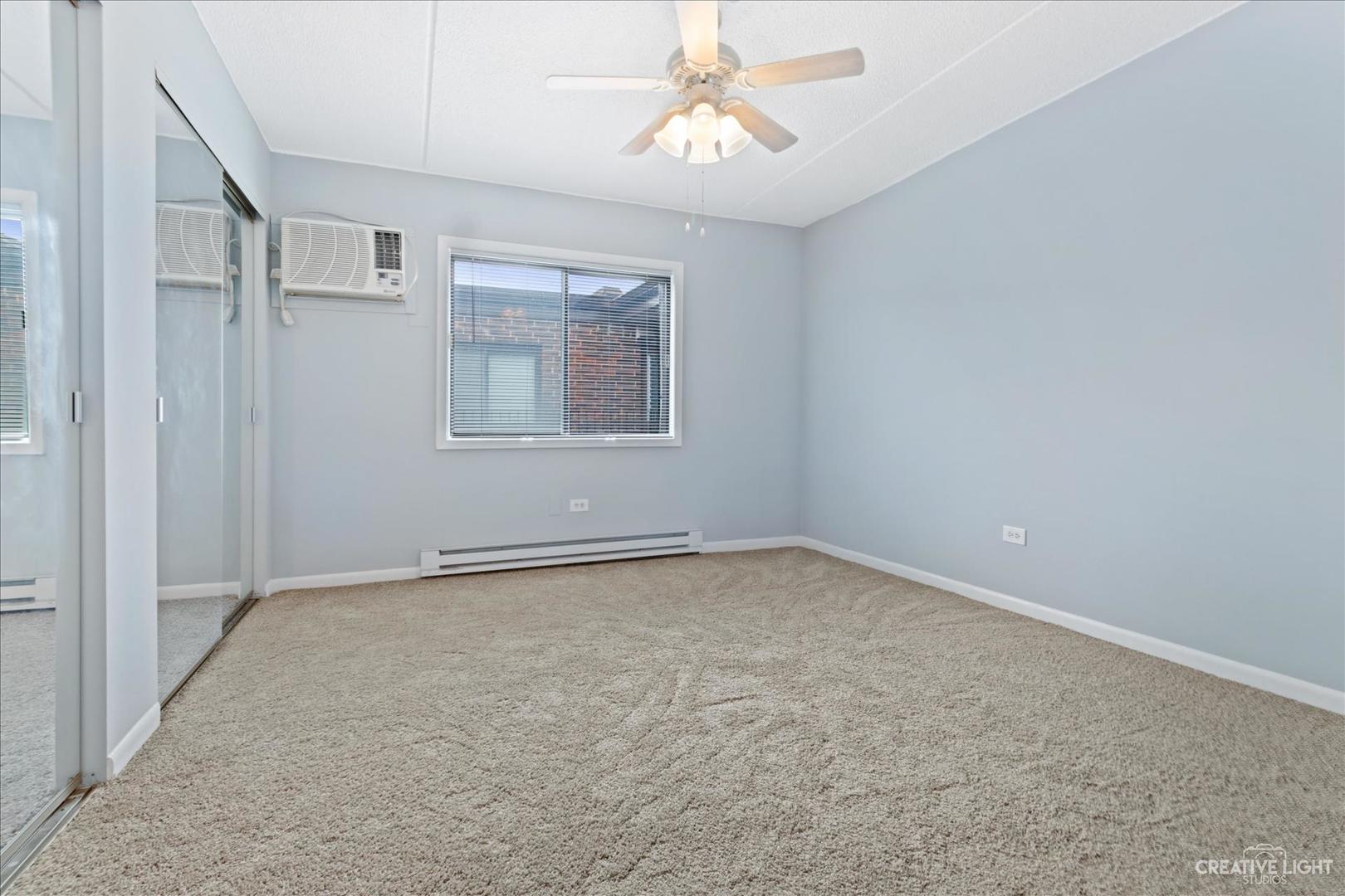 962 North Rohlwing Road, Unit 201B Addison, IL 60101 - Photo 15 of 18 a view of an empty room with a window