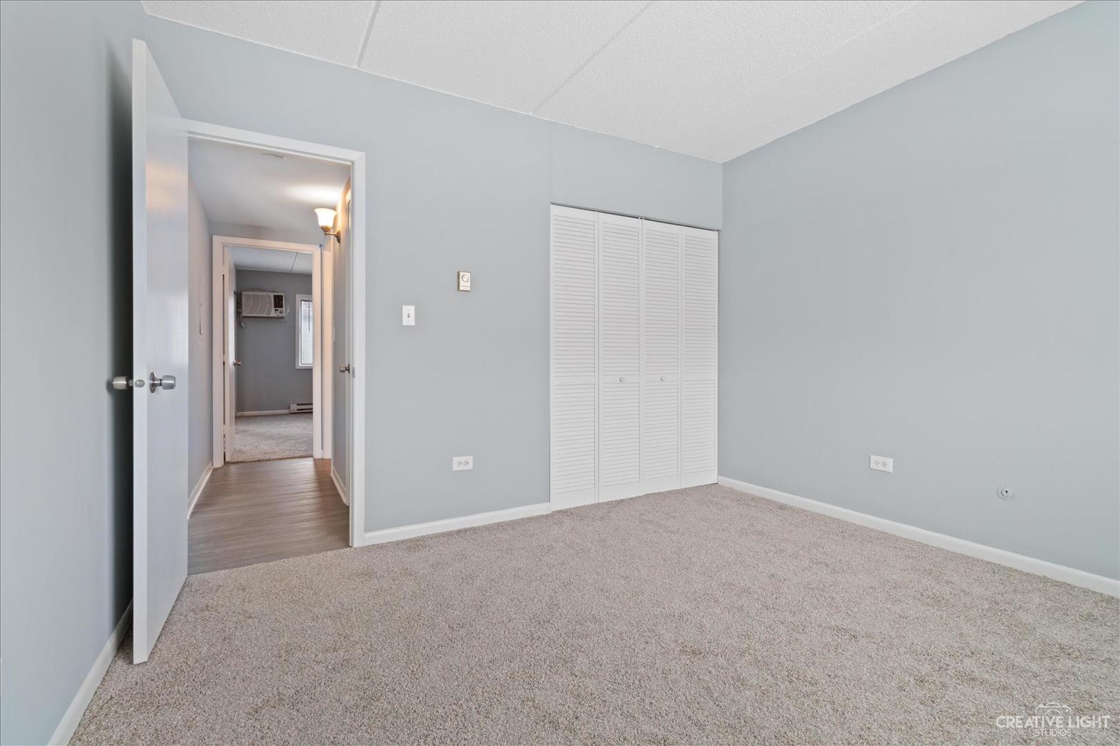 962 North Rohlwing Road, Unit 201B Addison, IL 60101 - Photo 18 of 18 a view of an empty room and closet
