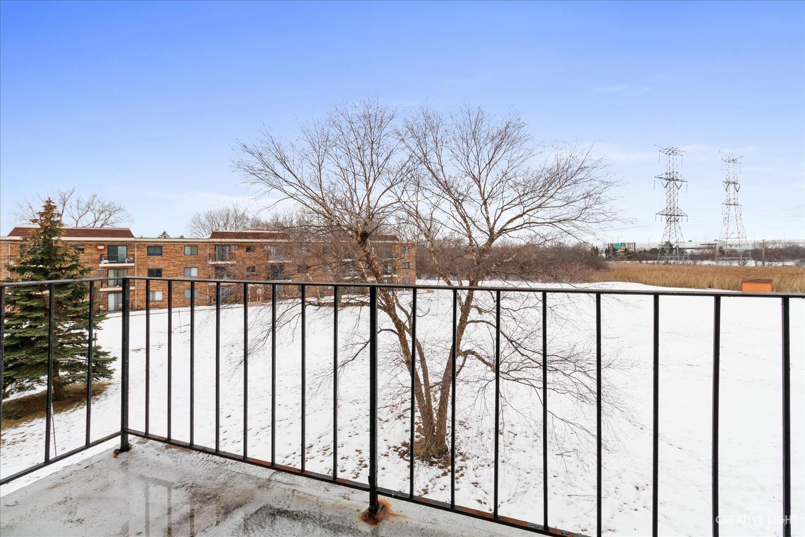 962 North Rohlwing Road, Unit 201B Addison, IL 60101 - Photo 3 of 18 a city view with iron fence