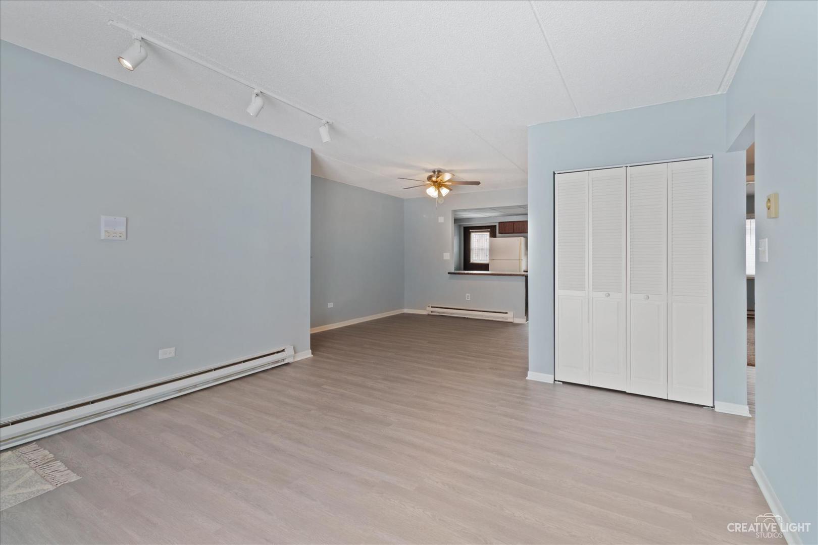 962 North Rohlwing Road, Unit 201B Addison, IL 60101 - Photo 4 of 18 a view of empty room with wooden floor