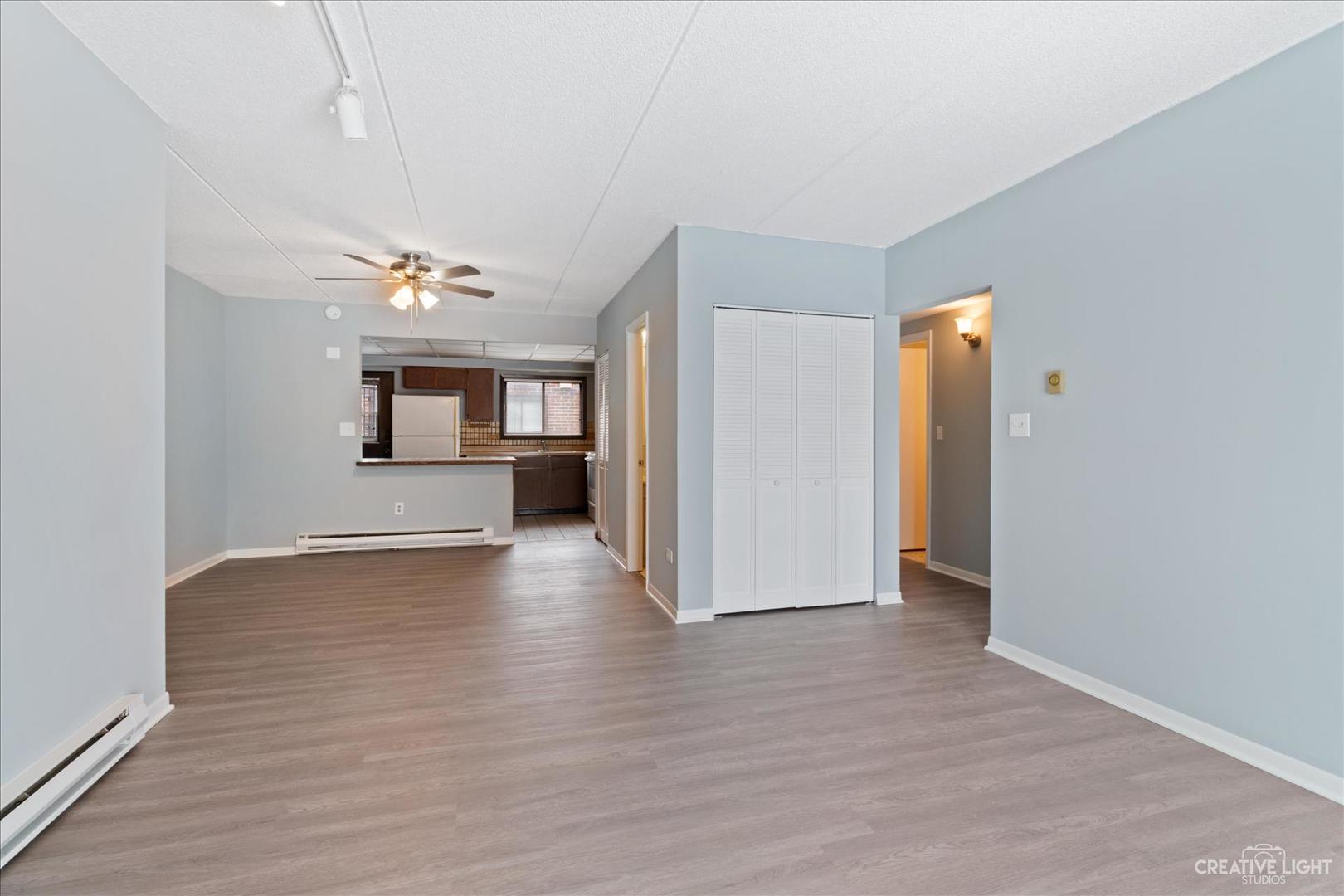 962 North Rohlwing Road, Unit 201B Addison, IL 60101 - Photo 5 of 18 a view of a livingroom with wooden floor