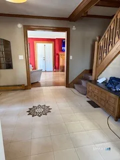 a view of an entryway with a rug