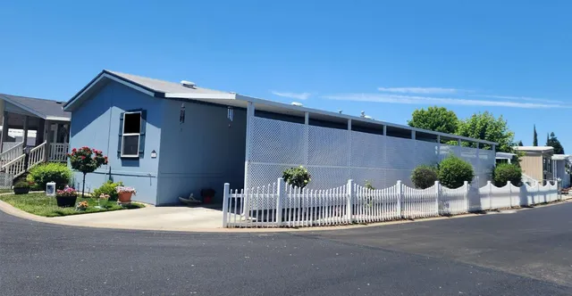 a view of a chairs and table in patio
