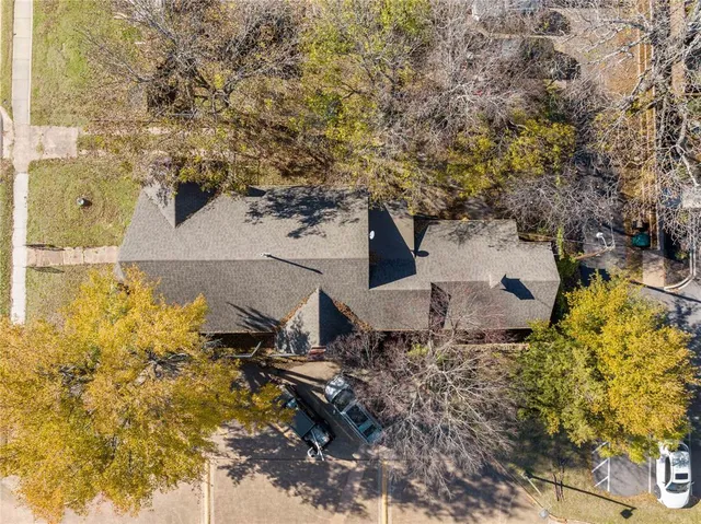 front view of a house with a tree