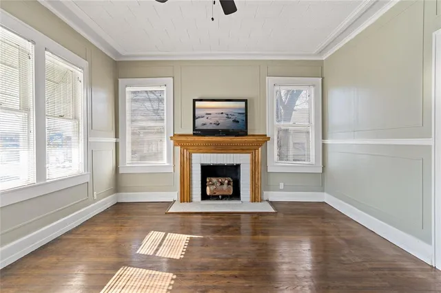 a living room with furniture window and fireplace