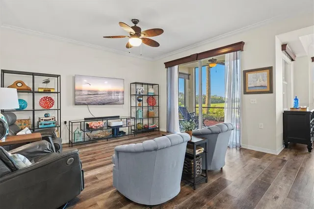 a living room with furniture and a large window