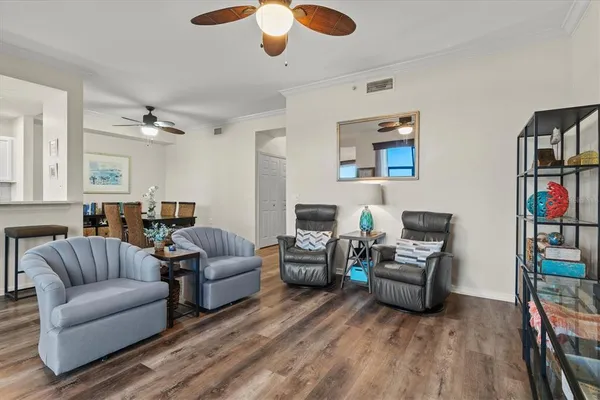 a view of a dining room with furniture and wooden floor