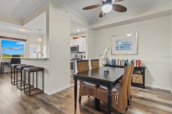 a kitchen with stainless steel appliances granite countertop a sink a stove and a microwave