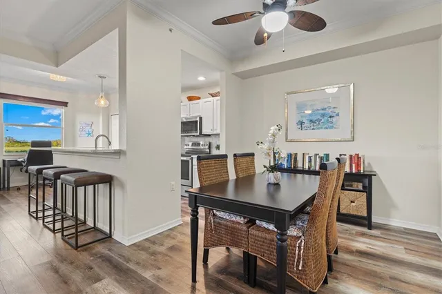 a kitchen with stainless steel appliances granite countertop a sink a stove and a microwave