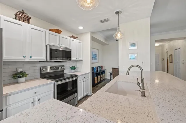 a spacious bedroom with a bed and a window