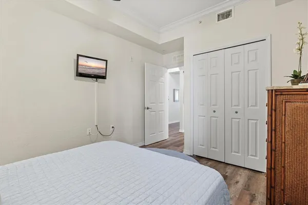 a view of a swimming pool with lawn chairs and a big yard