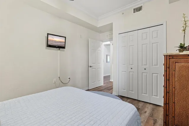 a view of a swimming pool with lawn chairs and a big yard