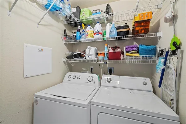 a view of a lake with a table and chairs