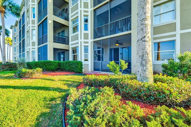 a living room with pool table and a chandelier