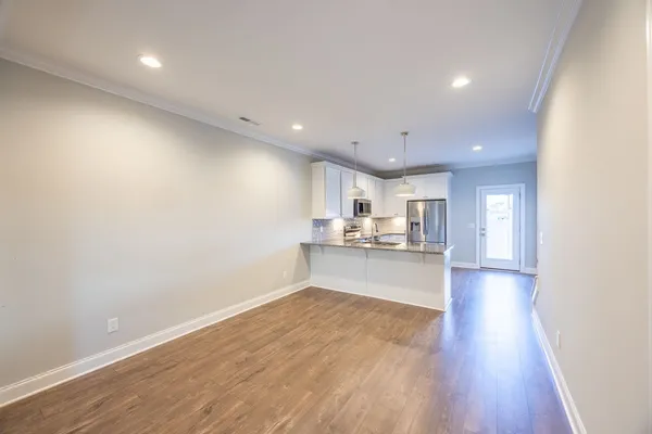 a view of a kitchen and kitchen with a sink