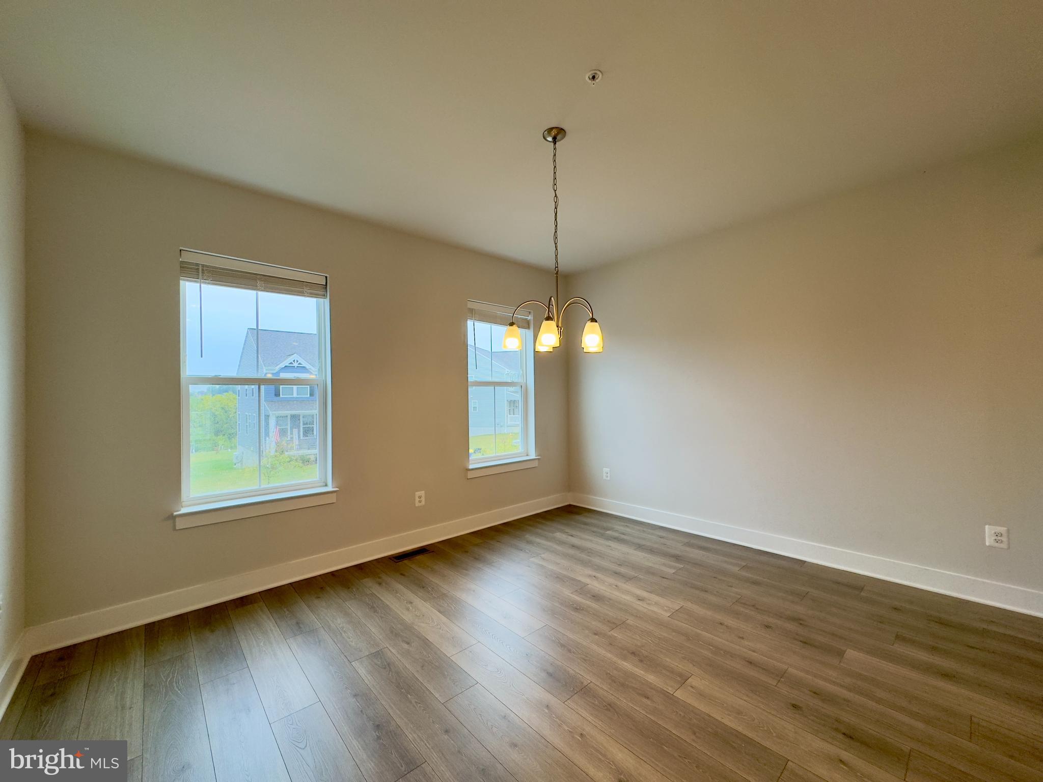 2775 Town View Circle New Windsor, MD 21776 - Photo 15 of 29 a view of an empty room with wooden floor and a window