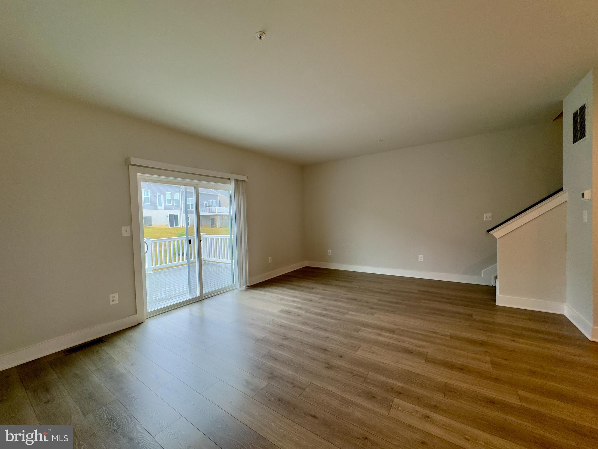 2775 Town View Circle New Windsor, MD 21776 - Photo 17 of 29 a view of an empty room with wooden floor and a window
