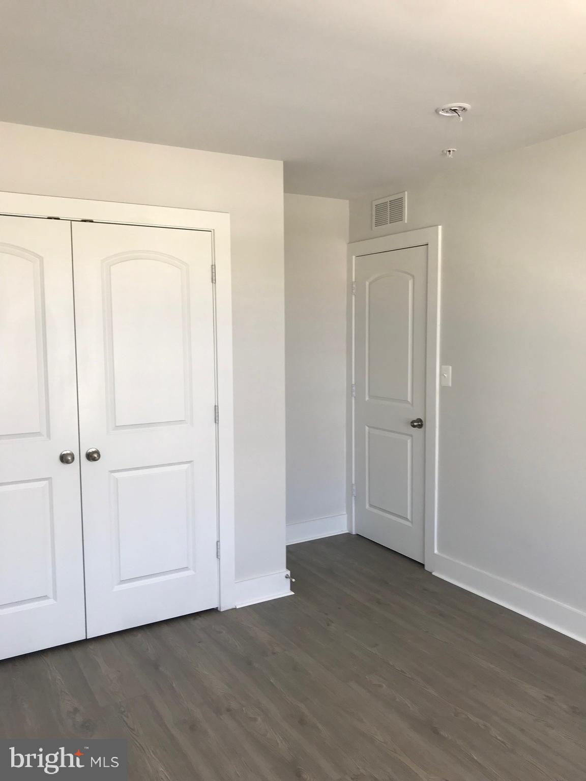 2775 Town View Circle New Windsor, MD 21776 - Photo 21 of 29 an empty room with wooden floor