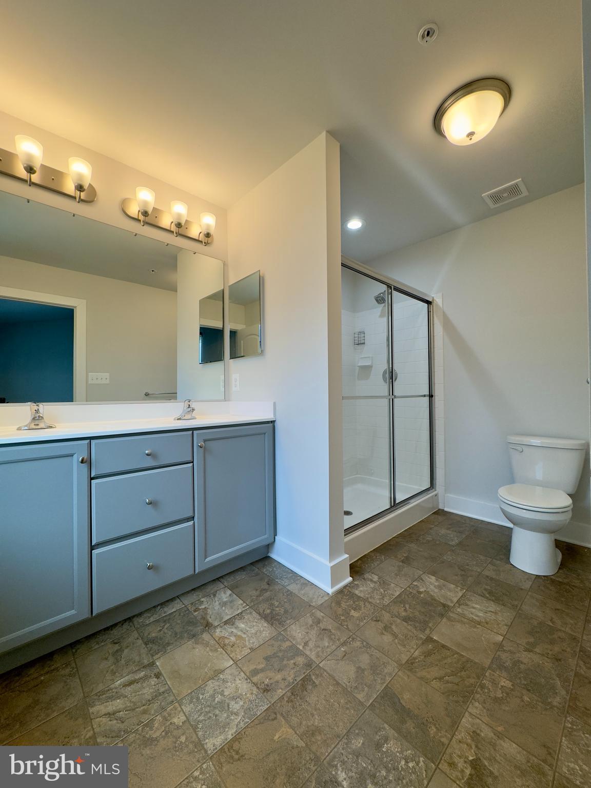 2775 Town View Circle New Windsor, MD 21776 - Photo 6 of 29 a bathroom with a granite countertop sink mirror and toilet