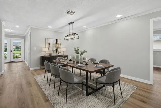 a view of a dining room with furniture and wooden floor
