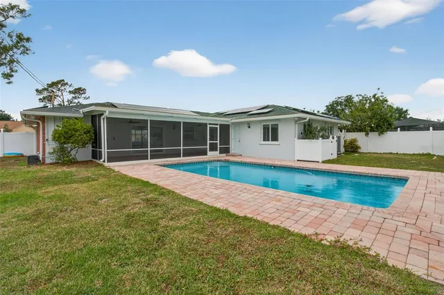 a view of a yard with potted plants