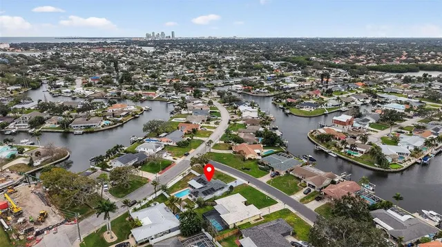 an aerial view of residential houses with outdoor space and street view