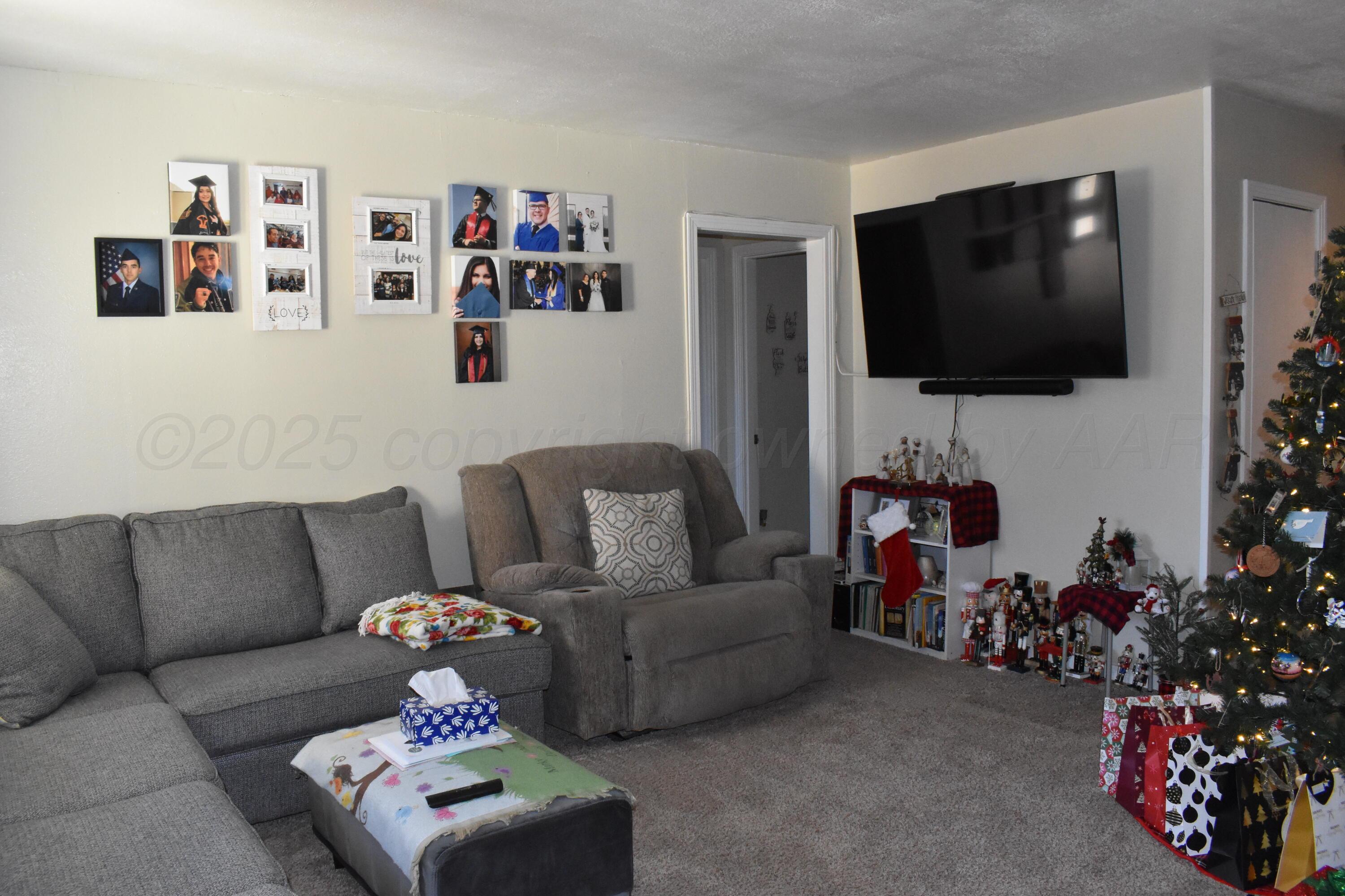 1919 Cherry Street Amarillo, TX 79106 - Photo 13 of 19 a living room with furniture and a flat screen tv