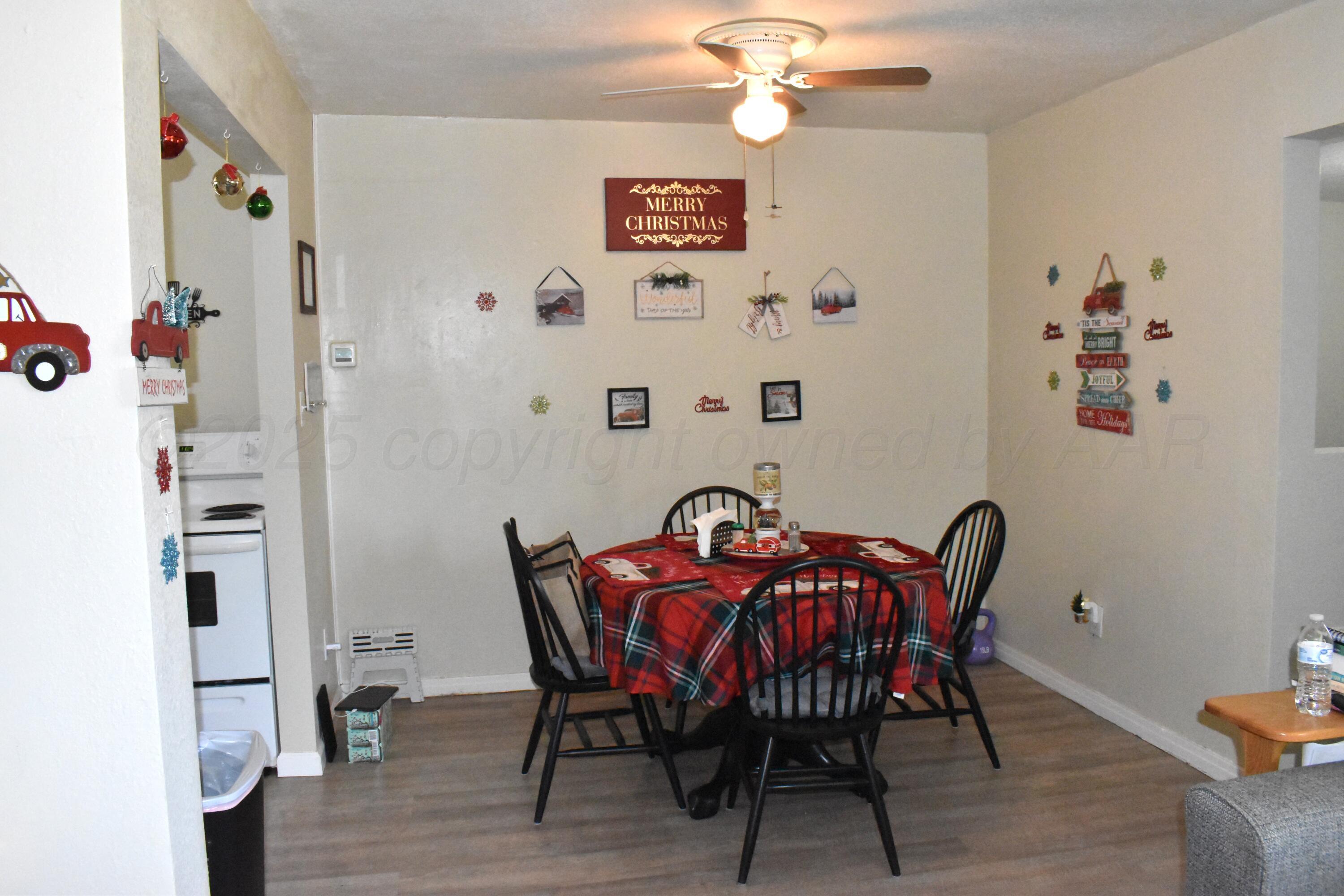1919 Cherry Street Amarillo, TX 79106 - Photo 9 of 19 a view of a dining room with furniture and chandelier