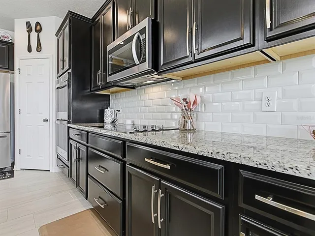 a view of a dining room with furniture and window