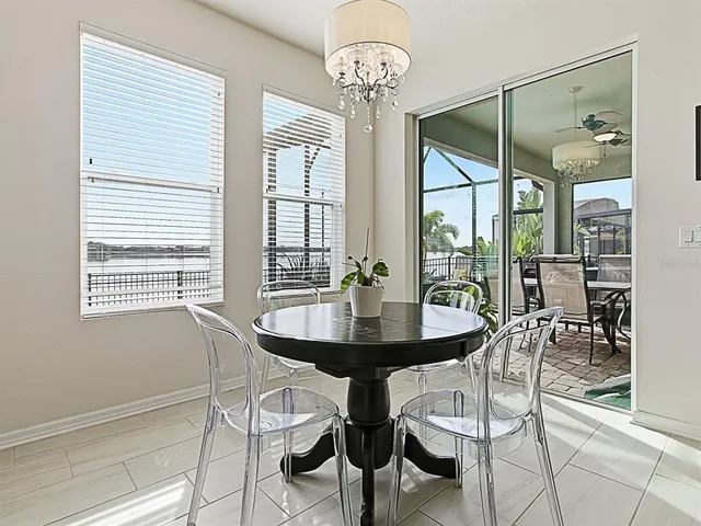 a building outdoor space with patio furniture and potted plants