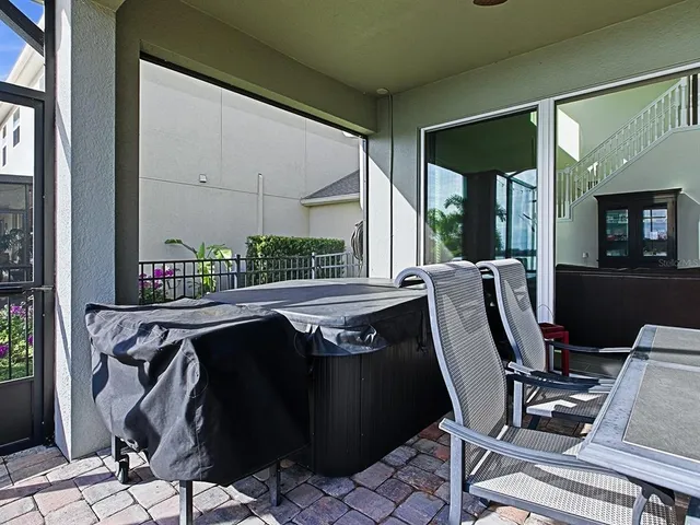 a bathroom with a granite countertop sink toilet and mirror