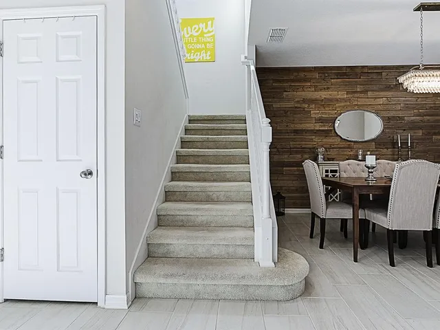a bathroom with a granite countertop sink two mirror and shower