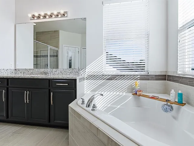 an aerial view of a house with a lake view